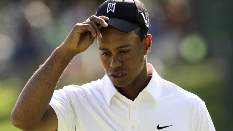 Tiger Woods walks off the 18th green after putting out during the first round of the AT&T National golf tournament at the Aronimink Golf Club, July 1, 2010, in Newtown Square, Pa. (AP / Rob Carr)