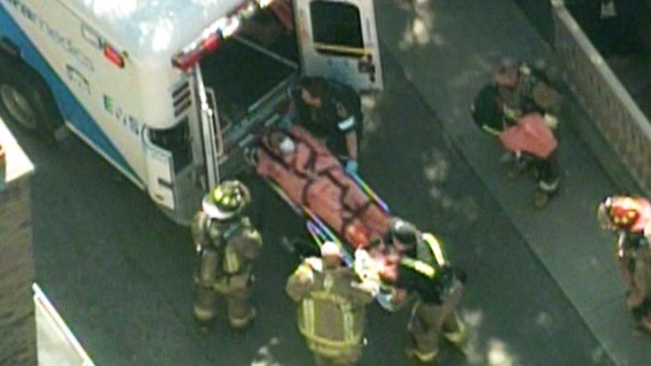One person is loaded into an ambulance outside 502 Huron St. on Friday, July 2, 2010.