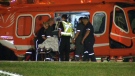 Emergency services airlift a man to hospital following a double shooting in Mississauga, Tuesday, June 19, 2012. 