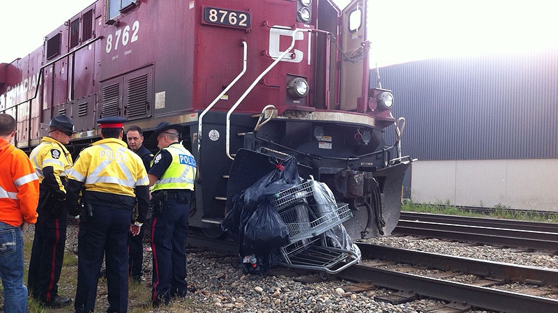 EPS investigators on the scene, of a collision between a train and pedestrian on Wednesday, June 20.
