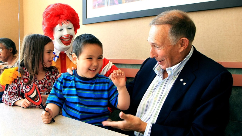 George Cohon, Founder of McDonald's Canada, and Ronald McDonald share smiles with their friends from Toronto's Ronald McDonald House on McHappy Day, Wednesday, May 5, 2010. The Canadian Press Images PHOTO/McDonald's Restaurants of Canada Limited