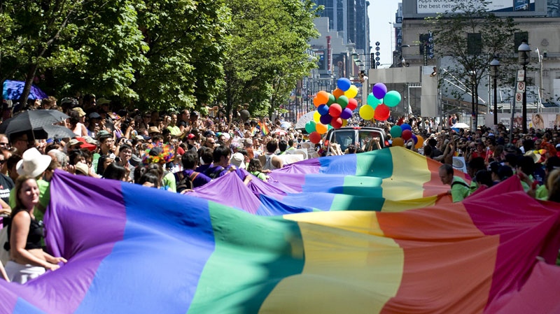 People take part in the Pride Parade in Toronto on Sunday, July 4, 2010. (Adrien Veczan / THE CANADIAN PRESS)