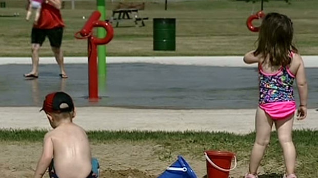 Kids cool off at new Smiths Falls splash pad located beside a sandbox June 21, 2012.
