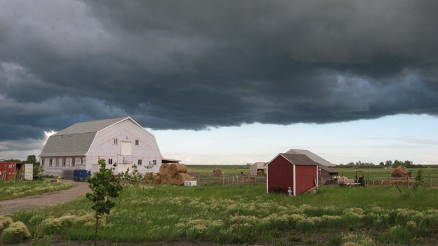 A storm approaches a farm close to Winnipeg