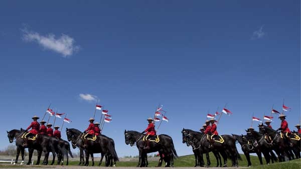 The RCMP Musical Ride is a summer tradition in Canada. (Adrian Wyld / THE CANADIAN PRESS)