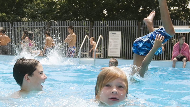 Children cool off in a public pool in Toronto, Wednesday, July 7, 2010. (Darren Calabrese / THE CANADIAN PRESS)  