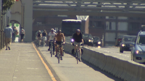 Cyclists cross Vancouver's Burrard Bridge on dedicated bike lanes. July 8, 2010. (CTV)