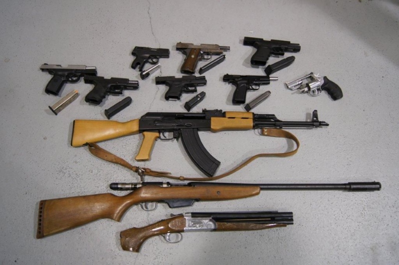 This file photo shows guns seized by Toronto Police on June 24, 2012. On Tuesday Ontario's highest court begins hearing a number of landmark cases on mandatory minimum sentences for gun crimes