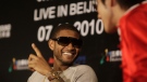 American R&B and pop singer Usher Raymond, gestures, while talking with Asian pop sensation Wang Lihong during a media conference in Beijing, China, Saturday, July 10, 2010. (AP Photo/Muhammed Muheisen)