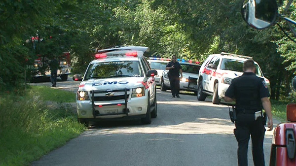 Emergency vehicles are seen in Ajax, Ont., where an 18-month old baby was pulled from a pond and rushed to hospital early Sunday, July 11, 2010.. 