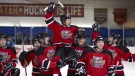Farley, the teenaged hockey star played by actor Noah Reid, is hoisted by teammates in this scene from Mongrel Media's 'Score: A Hockey Musical'