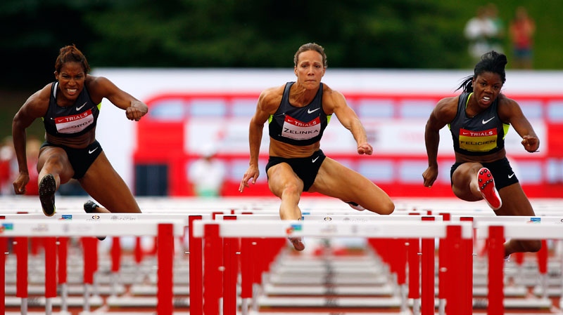 Jessica Zelinka, centre, from London, Ont., out races Phylicia George, left, and Perdita Felicien, to victory in the women's 100-metre hurdles at the Canadian Track and Field Championships in Calgary, Alta., Saturday, June 30, 2012. (Jeff McIntosh / THE CANADIAN PRESS)