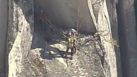 Rescue crews at The Chief in Squamish, B.C., secure a base jumper who was blown back against the mountain by wind. July 14, 2010. (CTV)