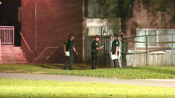 Police at the scene of a shooting in Flemingdon Park late in the evening of Tuesday, July 13, 2010.