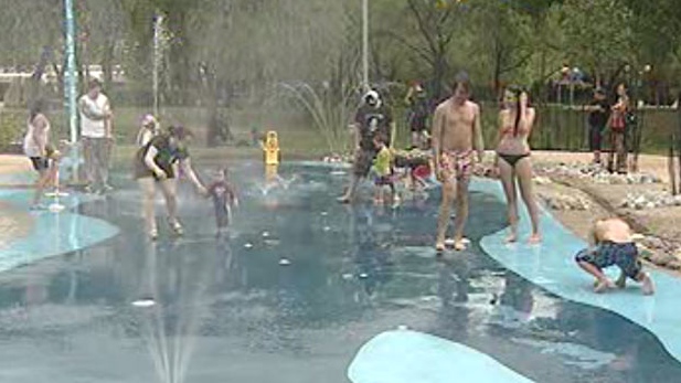 Winnipeggers keep cool Monday at a splash pad. 