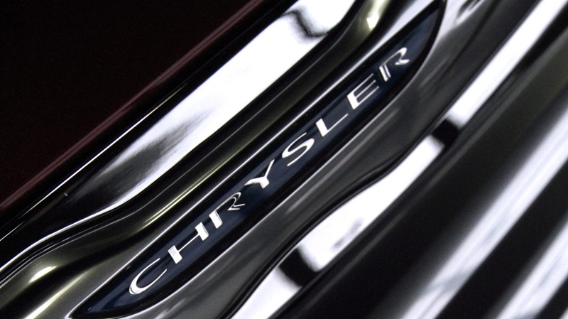 A Chrysler logo emblem is seen on the grill of a 2012 Chrysler 200.