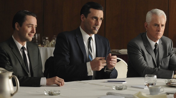 In this publicity image released by U.S. cable television network AMC, from left, Vincent Kartheiser portrays Pete Campbell, Jon Hamm portrays Don Draper and John Slattery portrays Roger Sterling in a scene from 'Mad Men.'