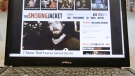A laptop displays the web site the smokingjacket.com, produced by Playboy Enterprises at the company headquarters in Chicago. (AP / M. Spencer Green)