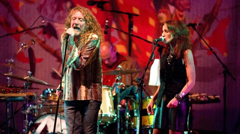 In this July 15, 2010 photo, musician Robert Plant, left, performs with Patty Griffin in Little Rock, Ark. (AP Photo/Brian Chilson)