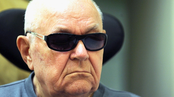 In this Tuesday, June 15, 2010 file photo accused Nazi death camp guard John Demjanjuk sits in a wheelchair as he arrives in a courtroom in Munich on Tuesday June 15, 2010. (AP / Christof Stache, Pool, File)