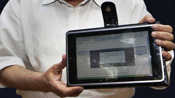 In this Thursday, July 22, 2010 photo, India's Human Resource Development Minister Kapil Sibal displays a low-cost tablet at its launch in New Delhi, India. (AP)