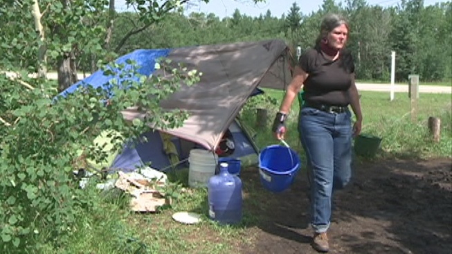 Jeanne Veronneau lives along the side of Highway #55 with her horse. 