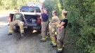 Fire crews take a break from checking for hot spots in the Marlborough Forest Thursday, July 12, 2012.