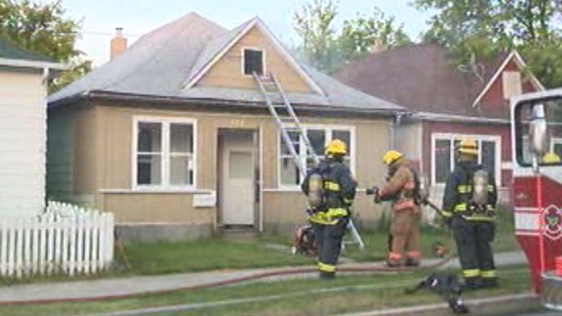 Firefighters extinguish a blaze on Polson Avenue, Thursday morning. (file image)