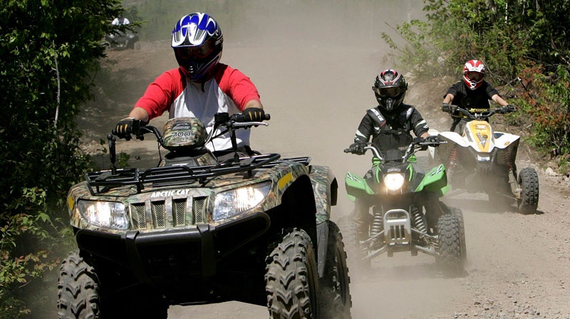 Three people are seen on a ride through Jericho Park's trail system, in Berlin, N.H., May 23, 2010. (AP / Jim Cole)