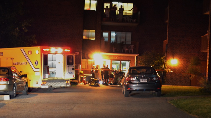 Residents of a Gamelin St. apartment complex watch as paramedics (CTV Montreal/Cosmo Santamaria, Jul