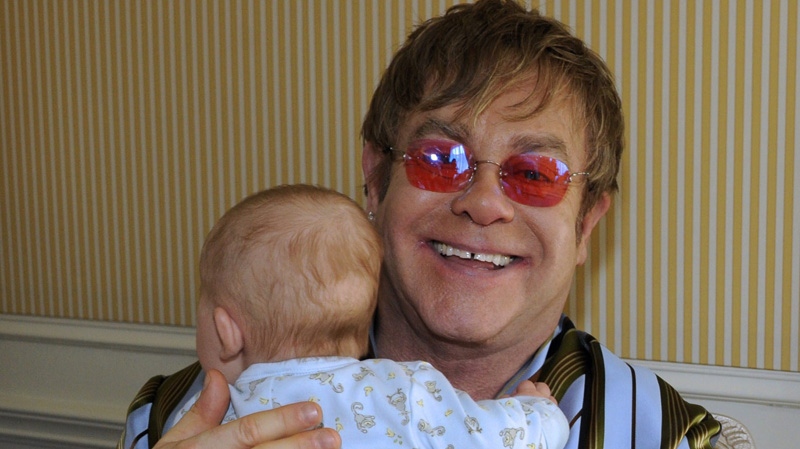 Elton John holds his son Zachary during an interview in New York on April 18, 2011.