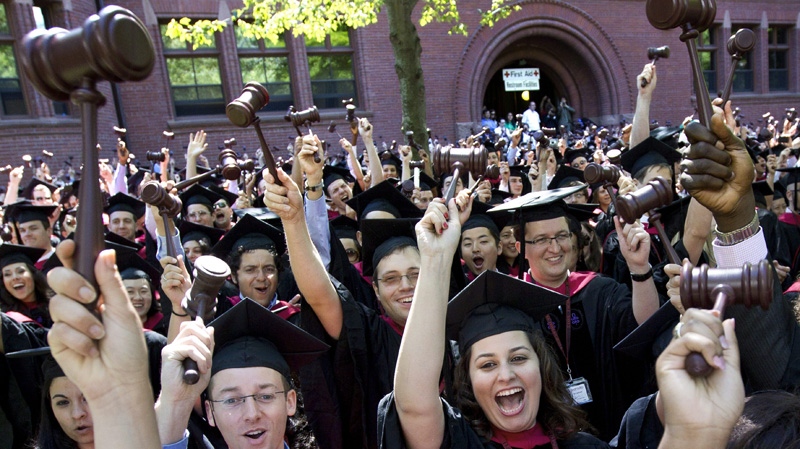 Graduates of Harvard Law School cheer during commencement exercises on May 24, 2012.