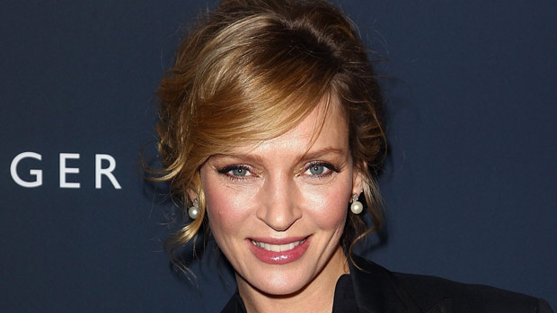 Actress Uma Thurman poses for a photo backstage at the Tommy Hilfiger Fall 2012 show during Fashion Week in New York, Sunday, Feb. 12, 2012. (AP Photo/ Donald Traill)