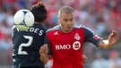 Toronto FC's Danny Koevermans challenges Philadelphia Union's Carlos Valdes for the ball during second half MLS action in Toronto on Saturday May 26, 2012. (Chris Young / THE CANADIAN PRESS)