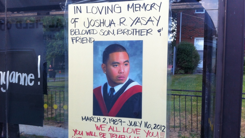 A poster memorializing Joshua Yasay, 23, who was one of two people killed in a shooting in Toronto