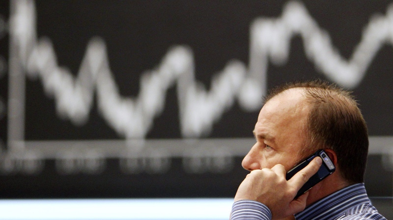 A trader makes a phone call at the stock market in Frankfurt, Germany on Jan. 20, 2012.