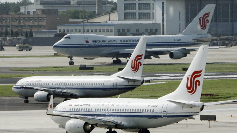Air China planes sit on the tarmac at Beijing Airport.