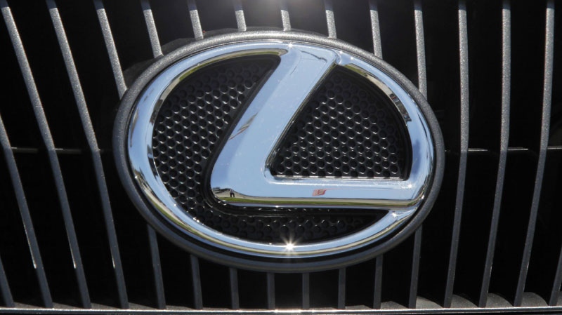 A Lexus nameplate is seen on a car on display at a Lexus dealership in the Woodland Hills area of Los Angeles, Thursday, July 1, 2010. (AP Photo/Reed Saxon)