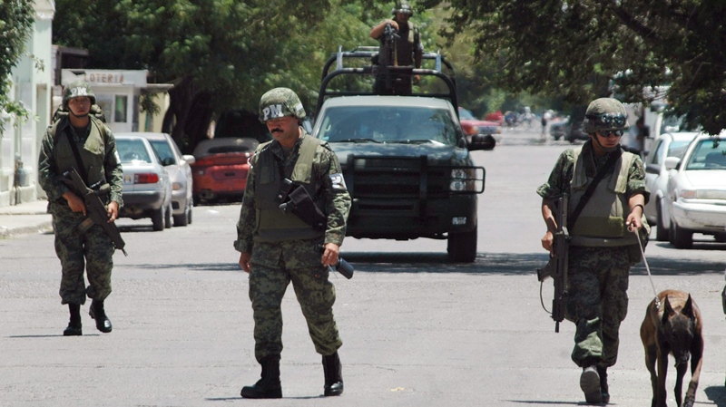 Soldiers patrol in Ciudad Juarez, Mexico, Tuesday, July 20, 2010. (AP Photo)