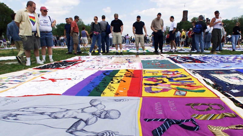 Visitors look at the new panels to the AIDS Quilt 