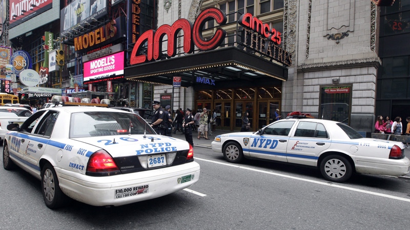 Police officers are seen outside an NYC cinema screening “The Dark Knight Rises,” on July 20, 2012.