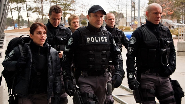 Enrico Colantoni, centre, as Sgt. Gregory Parker on the season 3 premiere of 'Flashpoint'