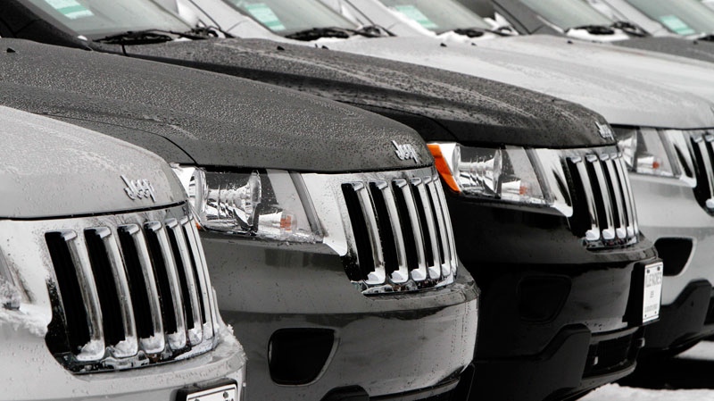 A row of 2012 Jeep Grand Cherokees sit on a lot in South Burlington, Vermont, January 31, 2012. (AP / Toby Talbot)