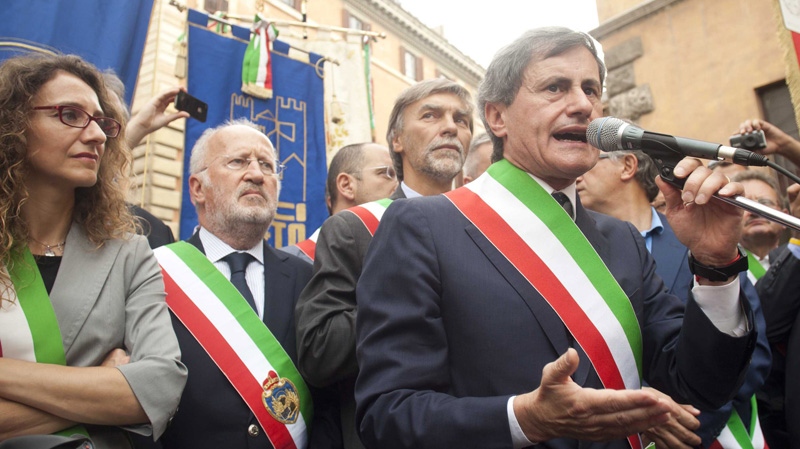 Rome's Mayor Gianni Alemanno, right, in Rome on July 24, 2012.