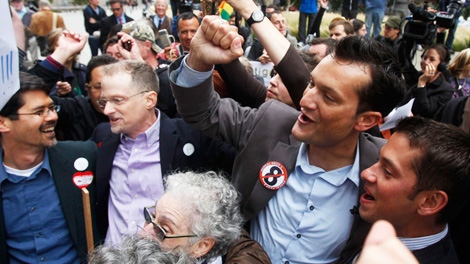 Stuart Gaffney, from left, his husband John Lewis, Spencer Jones, and his husband Tyler Barrick celebrate after hearing the decision in the United States District Court proceedings challenging Proposition 8 outside of the Phillip Burton Federal Building in San Francisco, Wednesday, Aug. 4, 2010. (AP Photo/Jeff Chiu)