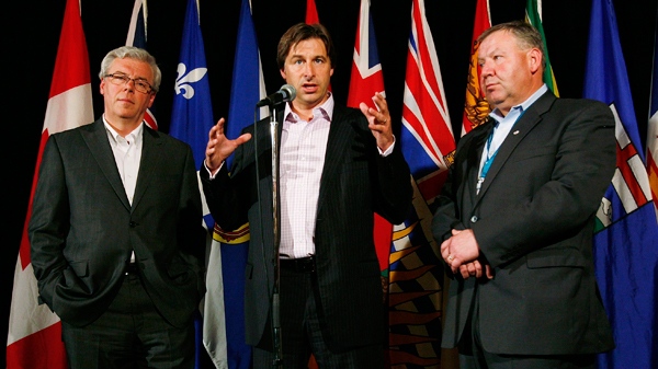 New Brunswick Premier Shawn Graham speaks at a press conference as Manitoba Premier Greg Selinger (left) and Nova Scotia Premier Darrell Dexter listen in at the annual Premiers Conference in Winnipeg, Thursday, August 5, 2010. (John Woods / THE CANADIAN PRESS)