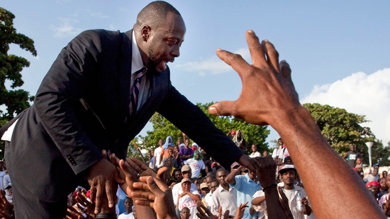 Haitian-born singer Wyclef Jean greets supporters after submitting the paperwork to run for president of Haiti in the next elections in Port-au-Prince, Haiti, Thursday, Aug. 5, 2010. (AP / Ramon Espinosa)