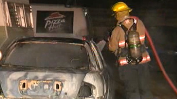 Fire crews extinguish a North Point Douglas car fire.