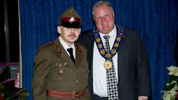 Toronto Mayor Rob Ford poses for with white supremacist Jon Latvis at a New Year's levee at city ha