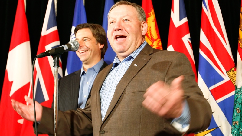 New Brunswick Premier Shawn Graham (left) and Nova Scotia Premier Darrell Dexter announce that the premiers have agreed to go back to their provinces and help promote the Bay of Fundy as one of the Seven Wonders of The World at the annual Council of the Federation Premiers' Conference in Winnipeg Friday, August 6, 2010. (John Woods / THE CANADIAN PRESS)